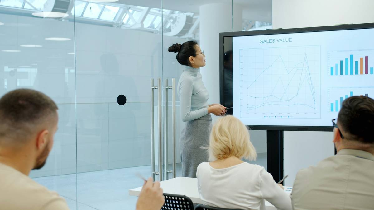 A modern smartphone displaying a clean business phone app interface with labeled buttons for calls, contacts, and settings.